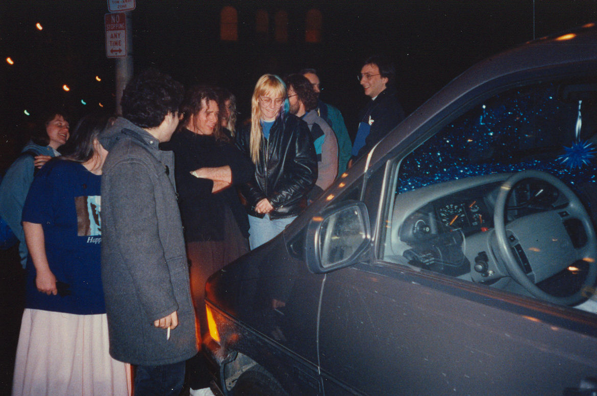 Meredith, Vickie, Angelos, Kevin Bartlett, Jessica looking at decorated van